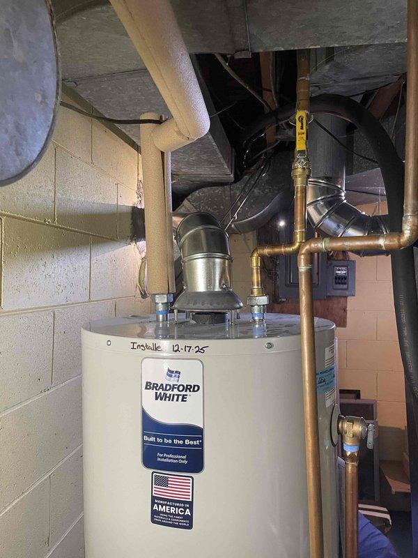 Completed installation of 110,000 BTU furnace with 4x25 chimney liner system and 40-gallon Bradford White water heater in residential basement. All mechanical connections, copper piping, gas lines, and venting installed per code requirements. Obtained necessary mechanical permits and completed utility reconnections for both heating and domestic hot water systems.