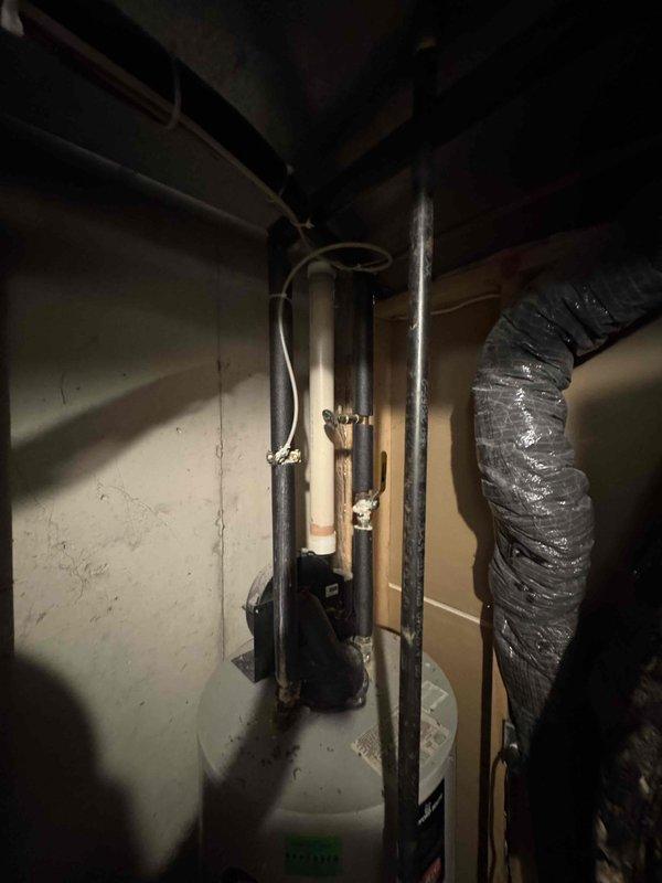 Provided comprehensive estimate for replacement of 20-26 year old HVAC system located in basement, including non-functional natural gas furnace and operational air conditioning unit. Assessed existing Coleman furnace installation, evaluated ductwork configuration including flexible ducting, reviewed ventilation and drainage piping infrastructure with visible PVC connections, and documented current system layout with foil-backed insulation and copper refrigerant lines. Presented equipment replacement options for complete heating and cooling system upgrade to restore full climate control functionality.