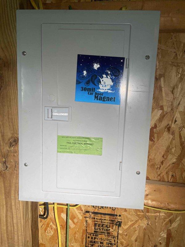 Completed on-site assessment for full house Generac generator installation at a 30-year-old residential property. Evaluated existing electrical infrastructure, including the main service panel—a Challenger brand breaker box located in an unfinished interior space with exposed OSB walls. Documented current electrical configuration with yellow Romex cables exiting the panel base. Assessed installation requirements and photographed relevant areas to determine proper generator sizing, transfer switch placement, and necessary electrical modifications for code-compliant whole-house backup power system integration.