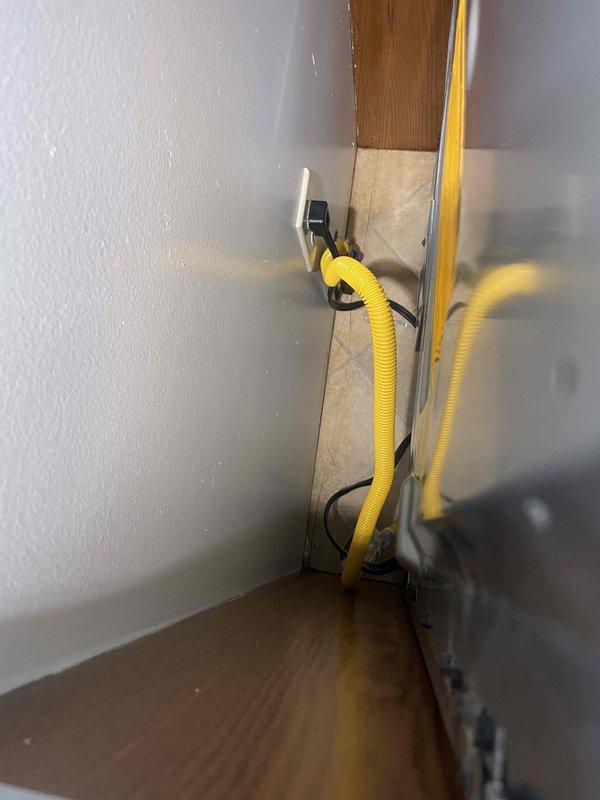 Completed on-site assessment for full house Generac generator installation at a 30-year-old residential property. Evaluated existing electrical infrastructure, including the main service panel—a Challenger brand breaker box located in an unfinished interior space with exposed OSB walls. Documented current electrical configuration with yellow Romex cables exiting the panel base. Assessed installation requirements and photographed relevant areas to determine proper generator sizing, transfer switch placement, and necessary electrical modifications for code-compliant whole-house backup power system integration.