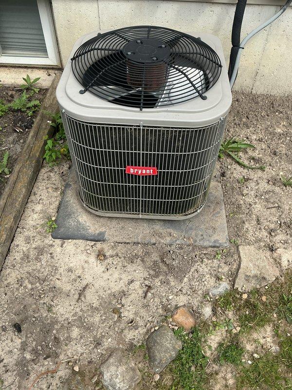 Completed annual cooling maintenance on Bryant outdoor condenser unit. Performed comprehensive system inspection, replaced air filter and evaporator pad as needed, and documented equipment condition with photos showing unit operational on concrete pad with minor weathering to surrounding area.