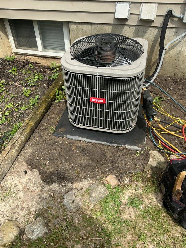 Completed annual cooling maintenance on Bryant outdoor condenser unit. Performed comprehensive system inspection, replaced air filter and evaporator pad as needed, and documented equipment condition with photos showing unit operational on concrete pad with minor weathering to surrounding area.