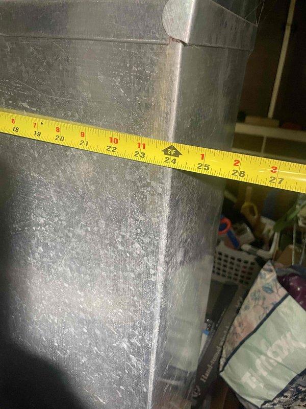 Conducted comprehensive assessment of existing 2006 furnace and air conditioning system located in basement for equipment replacement estimate. Documented current installation including furnace unit with existing ductwork connections and measured clearances for proper sizing of new equipment. Evaluated mini-split system as potential alternative solution based on site conditions and customer requirements.
