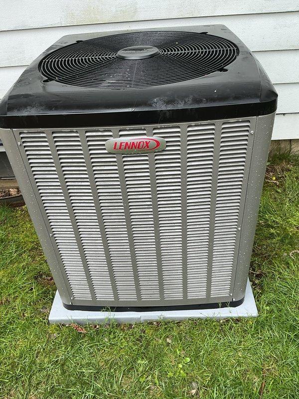 Performed scheduled annual cooling maintenance on Lennox outdoor condensing unit. Completed full system inspection including visual assessment of cabinet condition, fan assembly, and mounting pad. Unit found in operational condition with normal weathering for age. Verified proper placement on concrete pad and checked electrical disconnect box. System ready for cooling season operation.