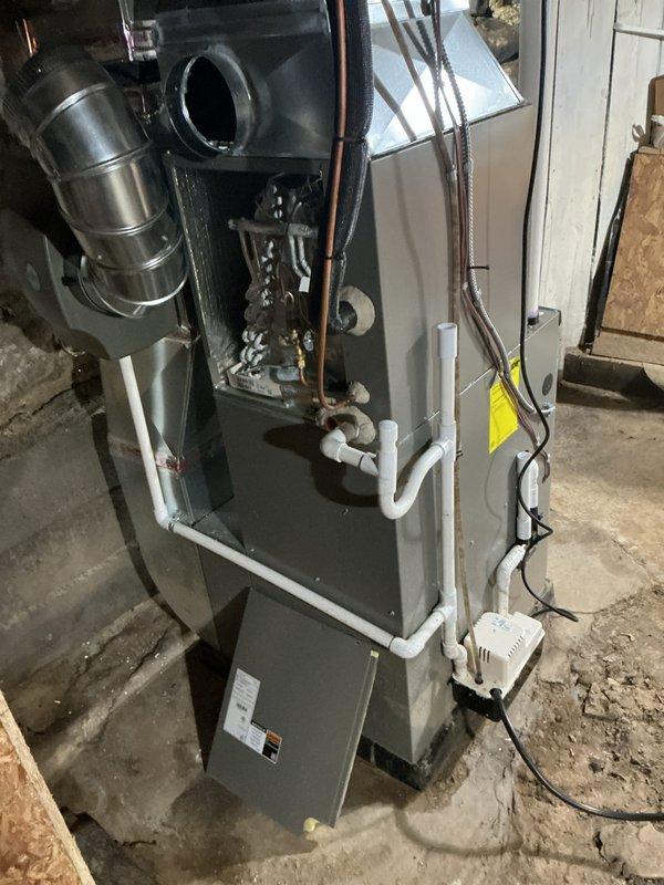 Completed scheduled Air Care Cooling maintenance on residential HVAC system. Performed comprehensive inspection of furnace unit, evaporator coil assembly, refrigerant lines, gas valve, and all associated components. Documented system condition with photos showing proper installation of PVC condensate drain lines, copper refrigerant tubing, and electrical connections all operating within normal parameters.