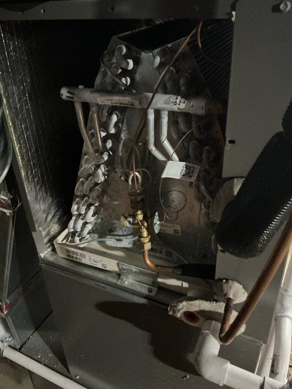 Completed scheduled Air Care Cooling maintenance on residential HVAC system. Performed comprehensive inspection of furnace unit, evaporator coil assembly, refrigerant lines, gas valve, and all associated components. Documented system condition with photos showing proper installation of PVC condensate drain lines, copper refrigerant tubing, and electrical connections all operating within normal parameters.