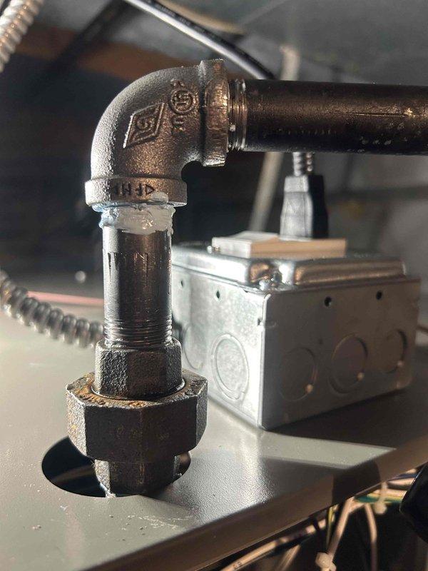 Responded to callback for propane leak following furnace installation. Inspected gas piping connections at furnace, identified leak at black iron pipe elbow fitting. Tightened threaded connections and verified proper seal at coupling joint. Performed leak detection test on all gas line connections using approved leak detection solution. Confirmed no further leaks present at furnace or gas supply piping. Also completed annual cooling maintenance on outdoor condensing unit as scheduled. Inspected condenser coil, verified refrigerant line connections, and checked electrical connections at unit. System operating within normal parameters.