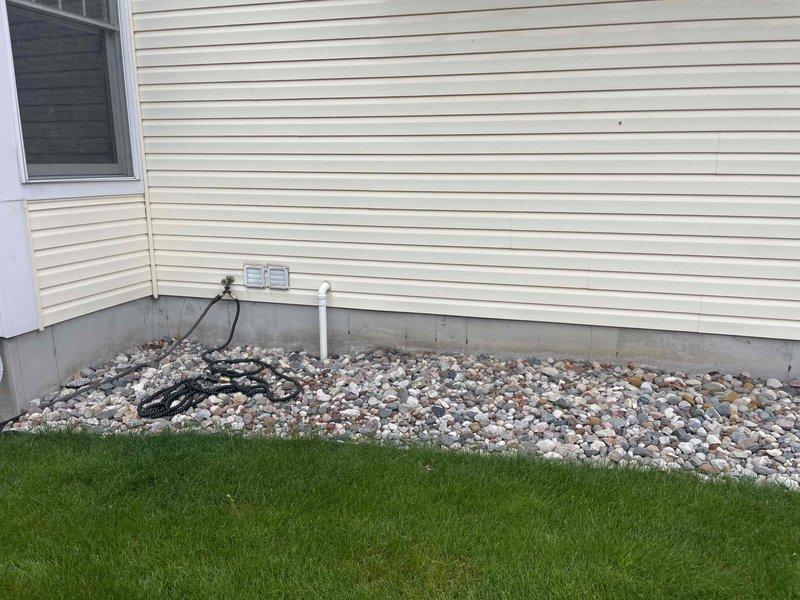 Conducted comprehensive estimate for full HVAC system replacement at residential property. Evaluated existing 25-year-old furnace and hot water heater, both at end of service life and requiring replacement. Performed thorough inspection of current heating system, water heating equipment, and associated venting infrastructure. Assessed exterior components including condensing unit placement, electrical service connections, and existing PVC vent terminations through foundation area. Documented equipment specifications, existing installation configuration, and utility connections via photographic survey. Evaluated structural considerations for new equipment installation including clearance requirements, venting pathways, and electrical service capacity. Provided detailed replacement recommendations for complete heating and water heating system upgrade to improve efficiency and reliability.