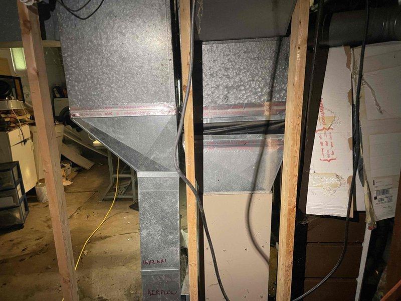 Completed comprehensive replacement estimate for residential HVAC system including 15-year-old York furnace and hot water heater. Inspected existing furnace installation, ductwork configuration, and utility room layout in basement area. Documented current equipment specifications, ventilation system, and spatial requirements for replacement units through detailed photography of furnace, metalwork plenum, and duct routing to provide accurate pricing and installation planning for customer.