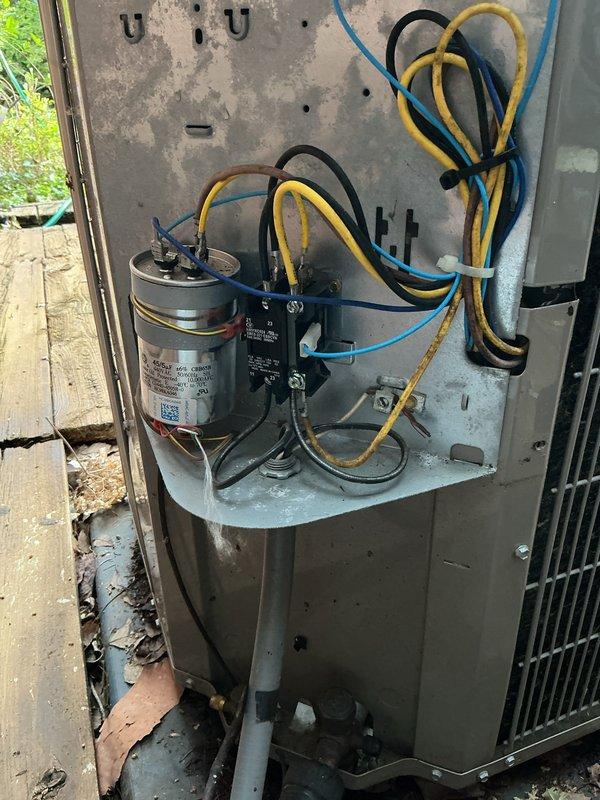 Completed comprehensive tune-up on outdoor air conditioning unit over 10 years old located on exterior wooden deck adjacent to brick structure. Performed full system inspection including access to electrical components, verified proper operation of capacitor and contactor with all wire connections secure, and confirmed unit functionality. System cleaned and serviced per manufacturer specifications with all components operating within normal parameters at time of service completion.