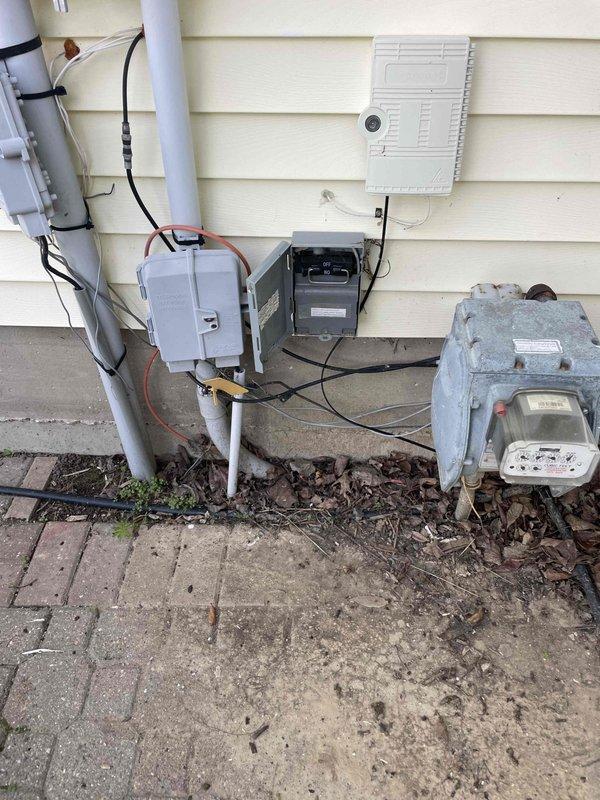 Provided estimate for replacement of basement-located natural gas furnace and air conditioning system under BOGO promotion. Current 12-year-old furnace operational but 30+ year-old AC unit not functioning. Documented existing HVAC equipment configuration including air handler with refrigerant lines, condensate drainage system, exterior utility connections, and electrical service components for replacement specifications.