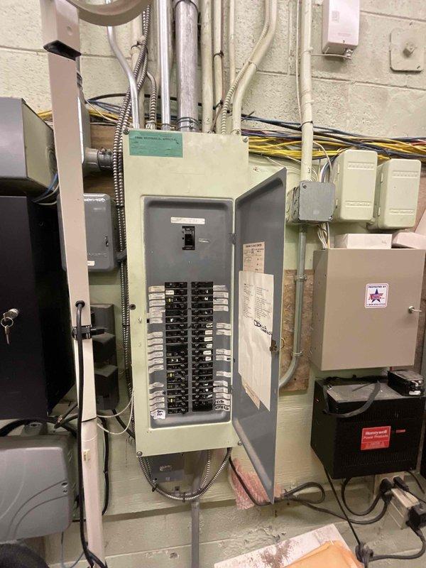 Conducted on-site assessment for mini split system installation at commercial property. Evaluated existing electrical infrastructure including main load center and available circuit capacity to determine power requirements for new mini split equipment. Documented electrical panel configuration, available breaker spaces, and conduit pathways to establish installation feasibility and electrical connection points for the proposed system.