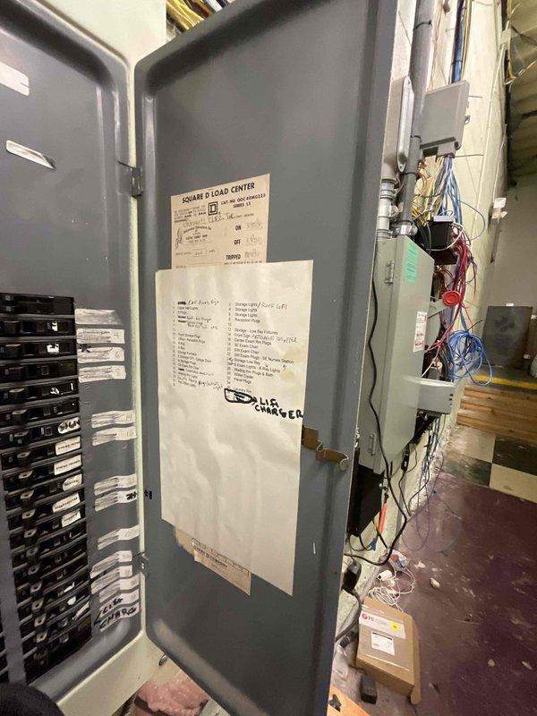 Conducted on-site assessment for mini split system installation at commercial property. Evaluated existing electrical infrastructure including main load center and available circuit capacity to determine power requirements for new mini split equipment. Documented electrical panel configuration, available breaker spaces, and conduit pathways to establish installation feasibility and electrical connection points for the proposed system.