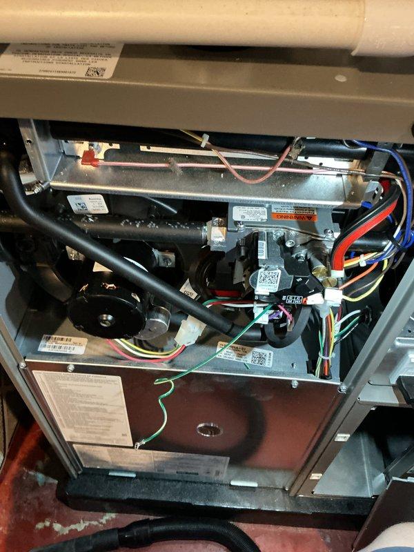 Completed routine maintenance on a one-year-old combination furnace and air conditioning system. Performed comprehensive AC tune-up including inspection of internal components, blower motor assembly, electrical connections, and control wiring. Verified proper operation of all mechanical and electrical systems using digital multimeter to measure system parameters and temperatures. All components found to be in excellent condition with no signs of wear, damage, or deterioration. System operating within manufacturer specifications with no issues identified or repairs required.