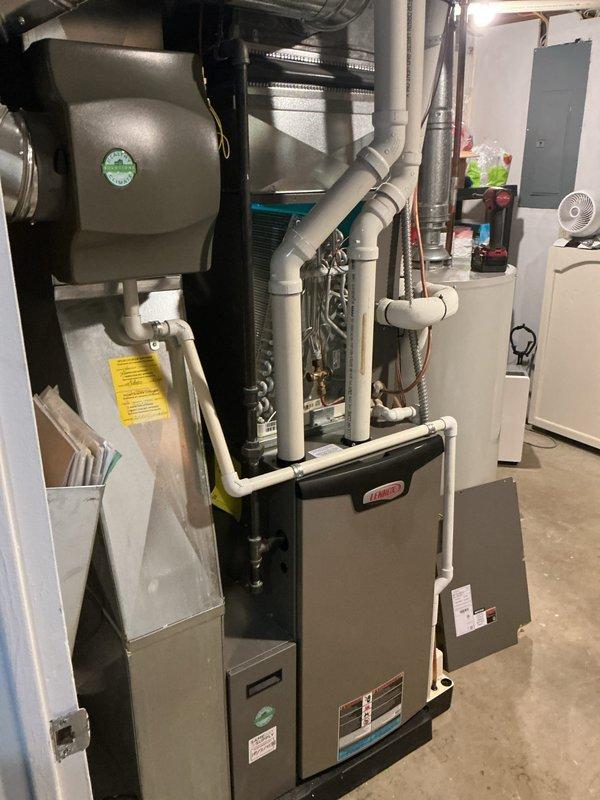 Completed annual cooling maintenance on Lennox HVAC system. Inspected evaporator coil, verified refrigerant levels, checked condensate drain lines, and tested system operation. All components found to be functioning properly with no issues identified.
