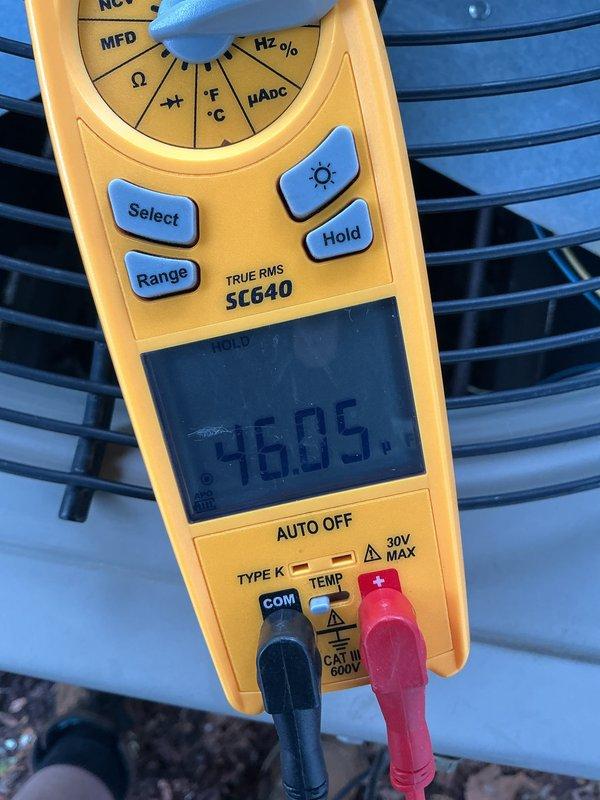 Completed annual cooling maintenance on residential HVAC system. Performed comprehensive inspection of outdoor condenser unit, checking electrical components and measuring capacitor reading of 9.6 MFD using digital multimeter. Replaced air filter and conducted hot water tank inspection as part of scheduled preventive maintenance service.