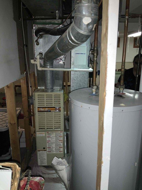 Conducted on-site evaluation of 10-year-old residential air conditioning system for replacement estimate. Assessed existing HVAC equipment configuration in basement mechanical room, including furnace unit with associated ductwork and system layout. Documented equipment specifications, current system conditions, and installation requirements through photographic documentation of mechanical room setup and relevant access points. Provided comprehensive replacement options and recommendations based on existing infrastructure and customer requirements.
