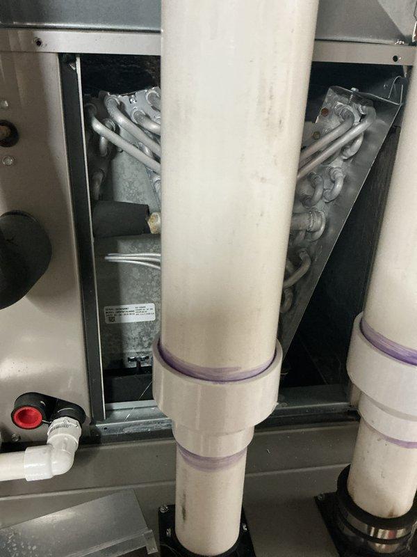 Completed annual cooling maintenance on HVAC heat pump unit. Inspected refrigerant lines, evaporator coil, and heat exchanger assembly, confirming proper operation and no visible leaks. Verified condensate drain lines are clear and functioning correctly, and documented system condition with photos showing all major components in operational status.