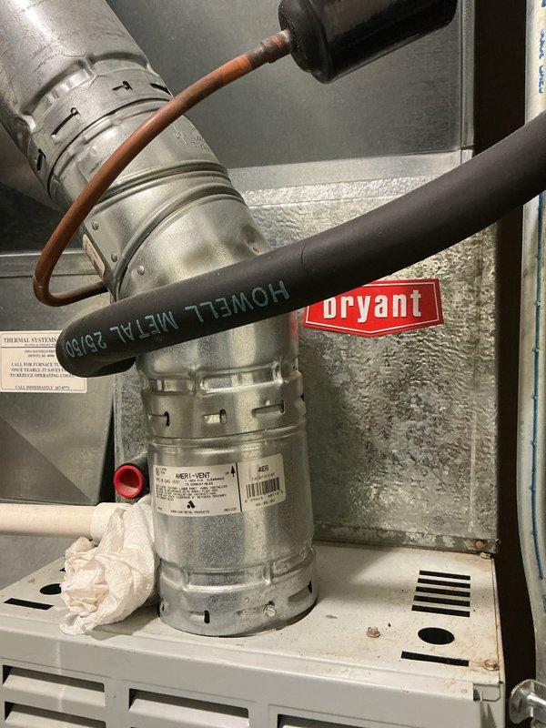 Completed annual cooling maintenance on Bryant HVAC system. Performed comprehensive inspection of evaporator coil assembly, ductwork connections, and refrigerant lines. Documented significant corrosion and rust buildup on evaporator coil copper tubing and metal collars, indicating advanced age and potential efficiency concerns. Inspected triangular A-coil configuration within metal framework, noting oxidation throughout parallel tube arrangement. Verified proper insulation placement behind coil assembly. Examined supply ductwork, refrigerant line connections, and electrical wiring routing. System operational at time of inspection. Photographed equipment condition for records. Recommend monitoring system performance closely and considering coil replacement due to extent of corrosion observed.