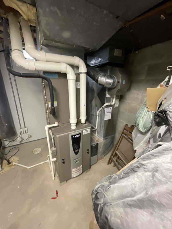 Provided comprehensive estimate for complete furnace and air conditioning system replacement in basement mechanical room. Existing 18-year-old equipment is non-operational and requires full replacement under BOGO promotion terms. Customer is an Air Care Member requiring updated HVAC solution for residential heating and cooling needs.