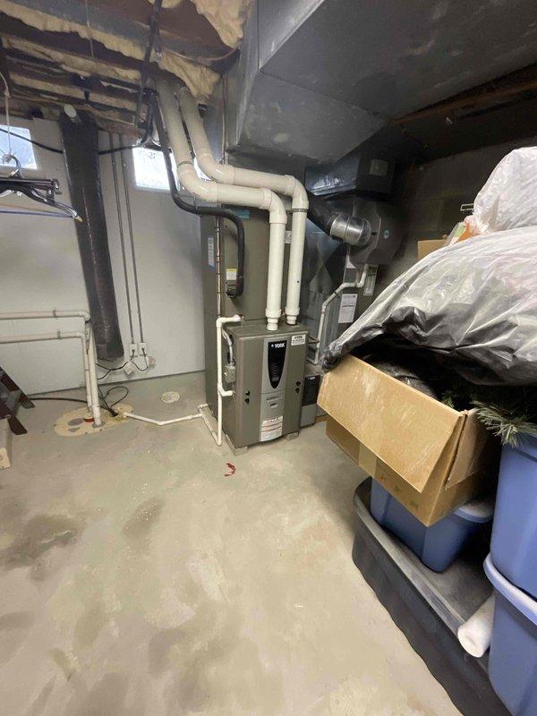 Provided comprehensive estimate for complete furnace and air conditioning system replacement in basement mechanical room. Existing 18-year-old equipment is non-operational and requires full replacement under BOGO promotion terms. Customer is an Air Care Member requiring updated HVAC solution for residential heating and cooling needs.