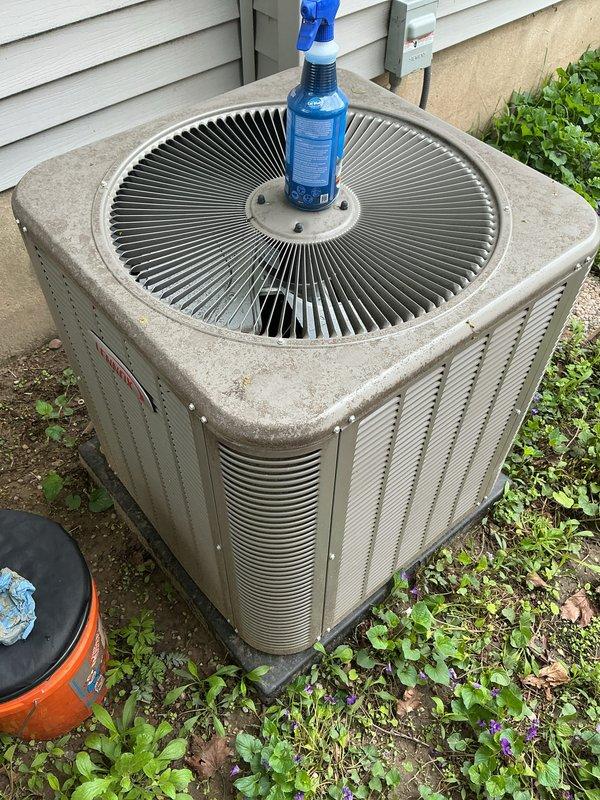 Completed annual cooling maintenance on residential HVAC system. Performed comprehensive inspection of indoor air handler unit, documenting significant dust accumulation and grime on blower motor assembly and internal components. Inspected outdoor condenser unit, verified proper operation of fan assembly, and applied coil cleaner to exterior surfaces. Checked refrigerant lines, condensate drain system with PVC U-trap configuration, and electrical connections throughout both units for proper function and safety compliance.