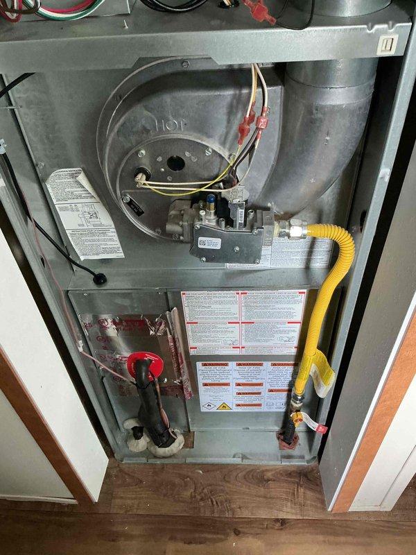Successfully completed full HVAC system installation including new air conditioning condenser unit and evaporator coil. Installed outdoor condenser unit on rubber isolation pad at rear of residence with proper clearances, mounted electrical disconnect box, and established new dedicated electrical circuit per code requirements. Interior work included evaporator coil installation integrated with existing furnace system, connected refrigerant lines with proper insulation, completed all electrical connections and control wiring, and verified proper gas line connections and safety controls. All mechanical, electrical, and air conditioning permits were obtained and system was tested for proper operation, refrigerant charge, airflow, and safety controls prior to final inspection.