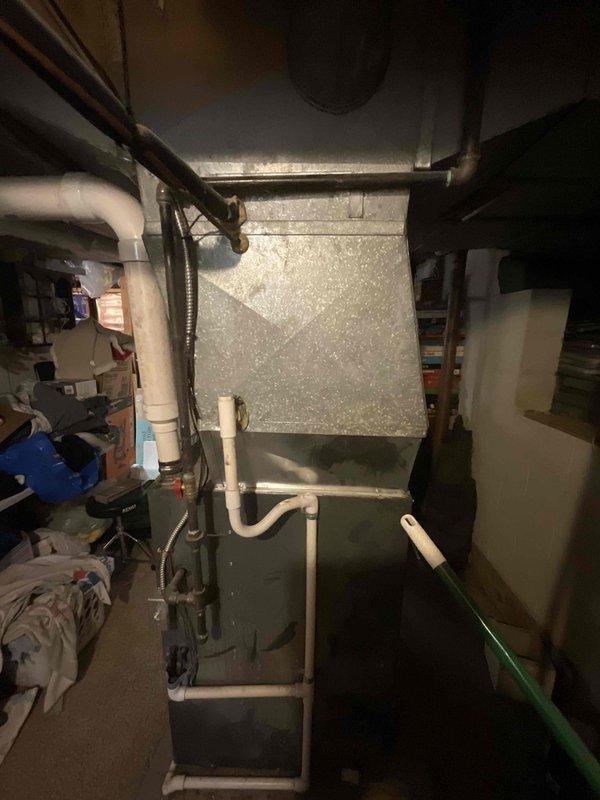 Provided comprehensive estimate for air conditioning system replacement in basement location. Current AC unit from 1987 remains operational but has exceeded expected service life. Evaluated existing installation including air handler, ductwork configuration, condensate drainage system, and electrical connections to determine proper replacement specifications and equipment sizing requirements for new high-efficiency cooling system.