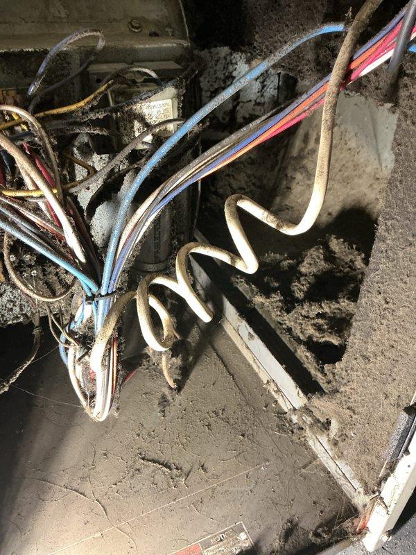Responded to no heat call on basement-located furnace unit. Upon inspection, found extremely aged equipment with extensive dust and debris accumulation throughout the system, including heavily clogged air return grille and deteriorated internal components. Documented equipment condition with photos showing tarnished copper coil, aged wiring, and significant buildup on all surfaces indicating lack of maintenance over extended period. Advised customer that unit has reached end of serviceable life and recommended complete system replacement. Customer pursuing replacement options through DHS program.