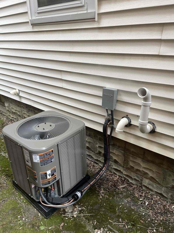 Completed full HVAC system installation including a 70,000 BTU furnace and 1.5 ton air conditioning unit with rear discharge configuration. Installed outdoor condensing unit on mounting pad with refrigerant lines properly insulated and secured to exterior wall, PVC condensate drain line with proper pitch and termination, and weatherproof electrical disconnect. Reconnected all necessary utilities and verified system operation upon startup.