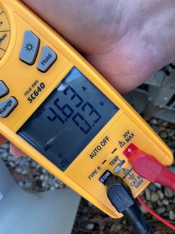 Performed annual cooling maintenance on Bryant outdoor condensing unit. Measured and recorded electrical parameters showing 36.37 amps and 232.5 volts, confirming proper system operation. Inspected condenser coil, fan assembly, and surrounding area, noting debris accumulation around unit base that was addressed during service.