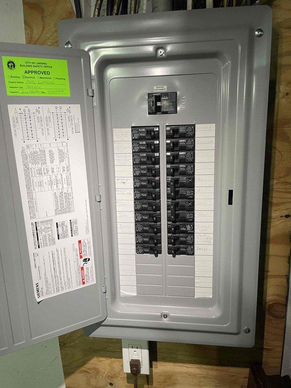 Conducted on-site evaluation of existing Lennox air conditioning system for replacement estimate. Current unit is operational and located with condenser positioned at exterior foundation and electrical panel in basement area. Assessed existing electrical disconnect, conduit routing, and main electrical panel capacity to determine compatibility requirements for new equipment installation.