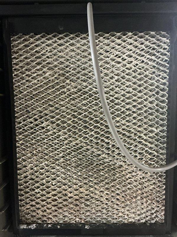 Completed scheduled air conditioning maintenance on residential HVAC system. Performed comprehensive inspection of furnace unit and associated equipment, verified proper operation of all components, and checked refrigerant lines and ductwork connections. Inspected and documented condition of air filter, noting accumulated debris and particulate buildup requiring monitoring. Assessed water heater installation in utility area and confirmed all safety labels visible and accessible. System operating within normal parameters at time of service completion.