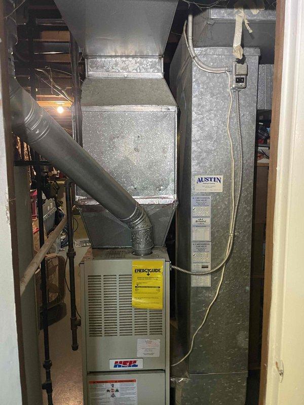 Responded to no-heat complaint on ancient furnace system located in basement. Performed full system assessment and measurements of existing HVAC equipment, including HSL furnace unit, galvanized plenum, ductwork, and evaporator coil. Provided comprehensive quote for complete system replacement, documenting equipment dimensions and configuration for proper sizing of new installation.