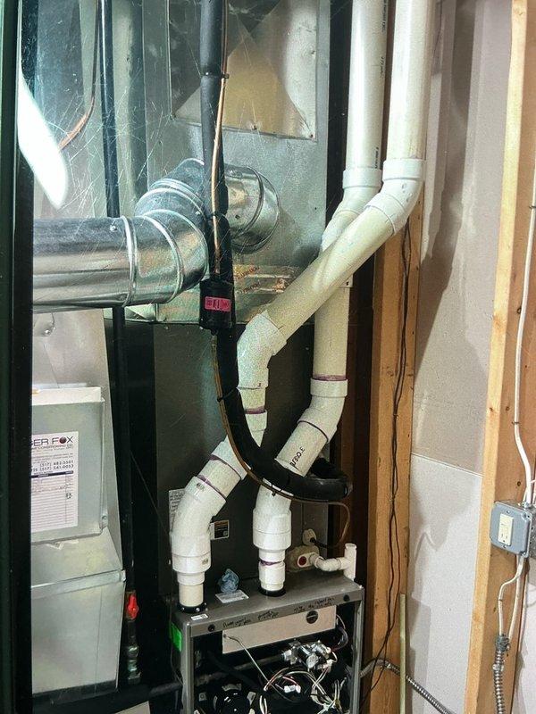 Responded to callback for 6-year-old furnace in basement experiencing no heat condition with error codes 240 (GF Low Flame Current - Run Mode) and 273 (GF Flame Fail In Run Mode). Upon arrival, system showed minimal airflow and multiple fault codes indicating flame sensing issues and excessive restart attempts. Inspected flame sensor, ignition system, and gas valve operation. Cleaned flame sensor rod to remove carbon buildup affecting flame current signal. Verified proper gas pressure at manifold and checked for adequate combustion air supply. Tested ignition sequence and confirmed flame establishment with proper microamp reading. Cleared fault codes from control board and cycled system through multiple heating cycles to verify stable operation. System now heating properly with no error codes present. Covered under parts warranty.
