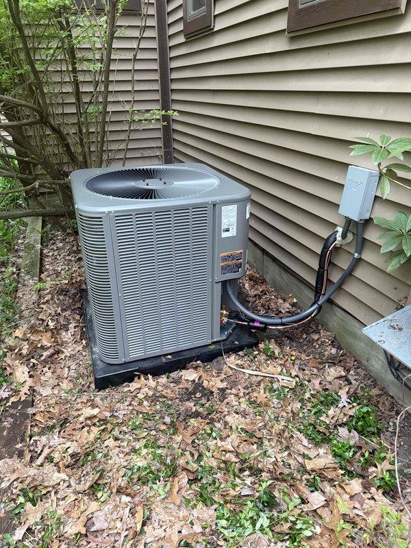 Completed full HVAC system installation including a 110,000 BTU high-efficiency furnace with humidifier and 3.5-ton air conditioning unit. Installed furnace in basement utility area with proper venting using white PVC piping, connected metallic ductwork with pyramid plenum configuration, and mounted all necessary electrical controls and condensate drain lines. Positioned outdoor condenser unit on composite base pad with appropriate clearance from structure, ran insulated refrigerant lines to exterior disconnect box, and reconnected all electrical components. System tested and operational upon completion, with all mechanical permits obtained prior to installation.