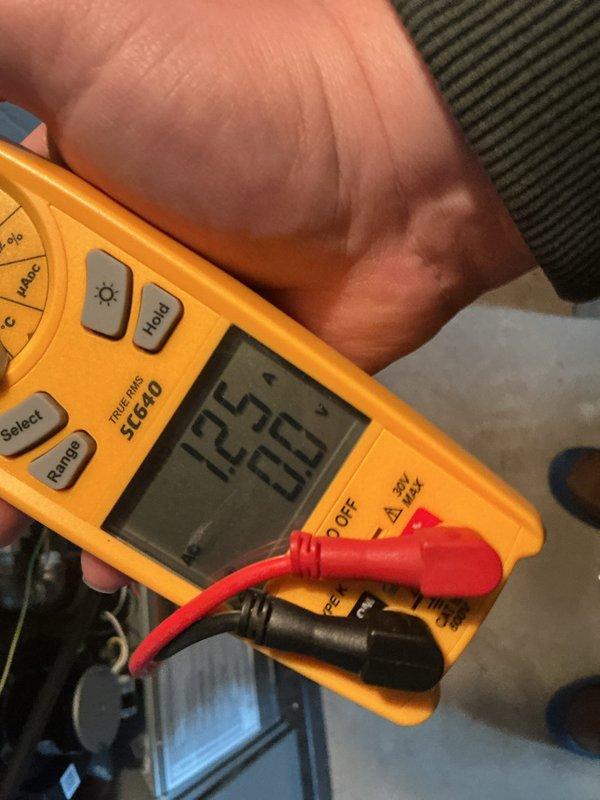 Completed annual cooling maintenance on residential air conditioning system. Performed electrical diagnostics using digital multimeter, verified system voltage readings, and inspected condenser unit components including wiring connections and internal controls to ensure proper operation for the upcoming cooling season.