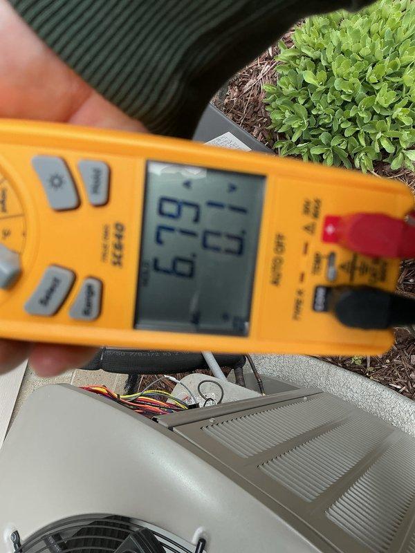 Completed annual cooling maintenance on residential air conditioning system. Performed electrical diagnostics using digital multimeter, verified system voltage readings, and inspected condenser unit components including wiring connections and internal controls to ensure proper operation for the upcoming cooling season.