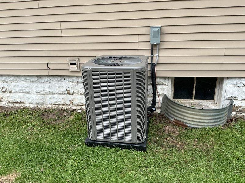 Completed full HVAC system installation including a 70,000 BTU furnace and 2-ton Lennox air conditioning unit with rear placement configuration. Installed outdoor condenser unit on pad against exterior wall with proper electrical disconnect, ran refrigerant lines and electrical conduit, and reconnected all system components. All permits obtained, system tested and operational upon completion.