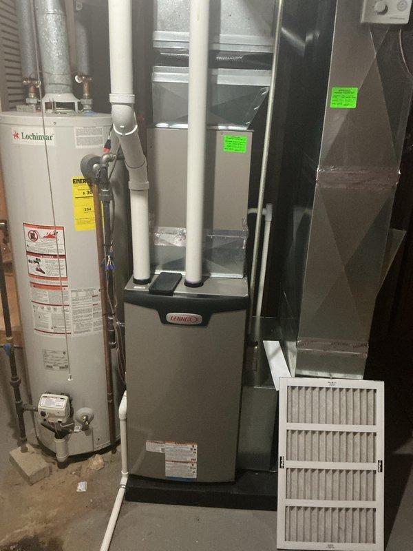 Completed annual cooling maintenance on Lennox HVAC system. Performed comprehensive inspection of furnace unit, ductwork connections, and associated components including water heater piping and PVC condensate lines. Replaced air filter and verified all system connections, manufacturer labels, and safety compliance stickers were intact and properly displayed.