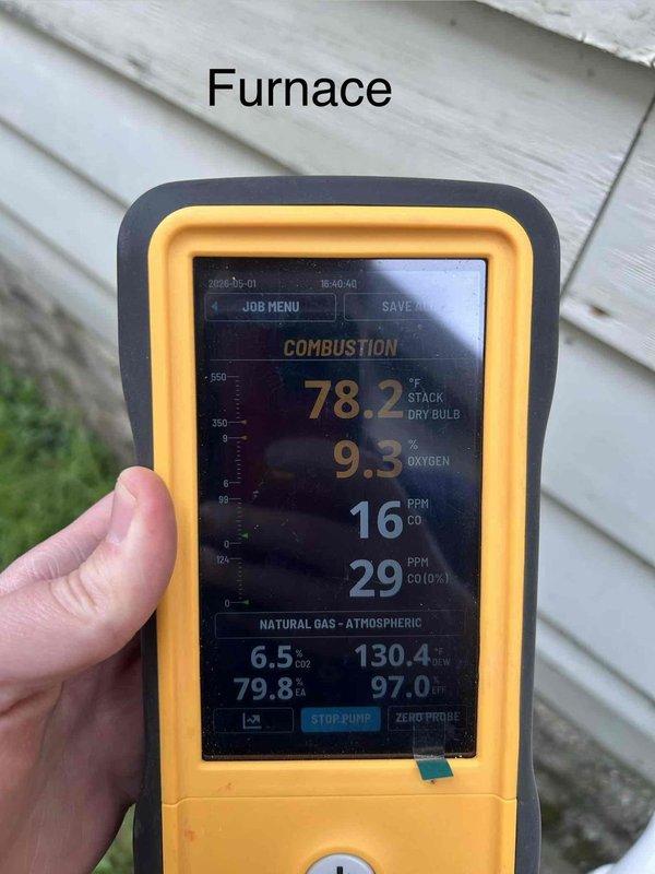 Responded to carbon monoxide alarm activation with "move to fresh air" alert at residence with one-year-old gas furnace and water heater. Performed comprehensive combustion analysis on furnace using digital analyzer, which revealed elevated carbon monoxide levels of 16-29 PPM in flue gas with 9.3% oxygen content and combustion efficiency reading of 97.0%. Conducted thorough safety inspection of both gas-fired appliances, including visual examination of heat exchanger, burner assembly, and venting system components. Documented combustion readings and equipment conditions with photographs for service records.