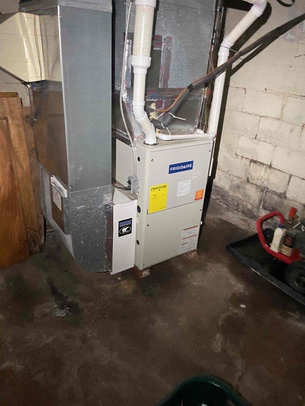Completed comprehensive site assessment for new whole home Generac generator installation. Evaluated existing electrical infrastructure, including main service panel location in basement mechanical room adjacent to Frigidaire furnace and gas distribution system. Documented current HVAC and utility configurations, photographed electrical service access points, and assessed optimal generator placement for code-compliant installation with proper clearances from existing equipment and structures.