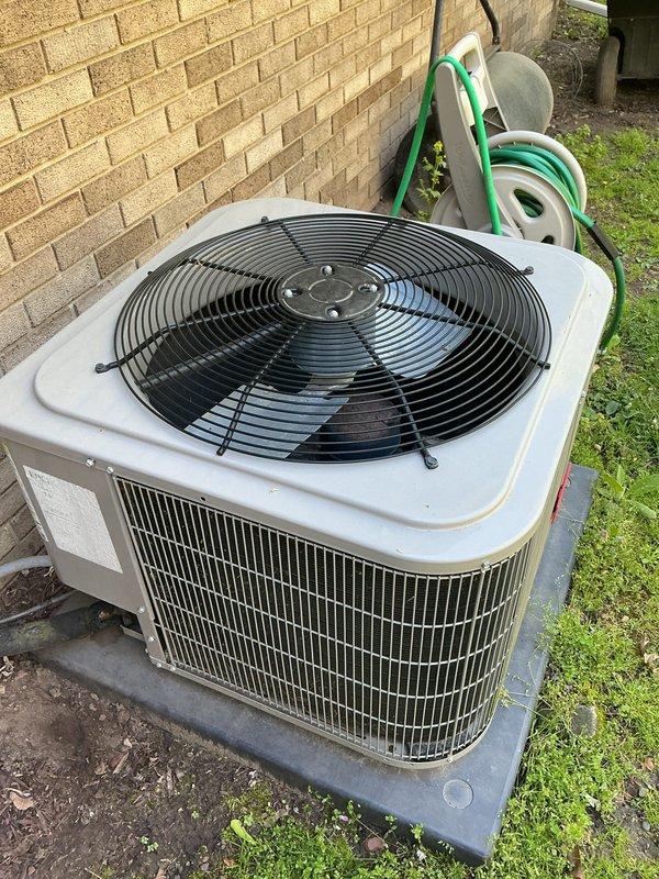 Completed annual cooling maintenance on residential HVAC system. Performed comprehensive inspection of indoor furnace unit located in basement utility area and outdoor condenser unit, verifying all components operational and properly connected. Documented equipment condition with photographs showing copper refrigerant lines, ductwork connections, and condenser coil in serviceable condition with no immediate repairs required.