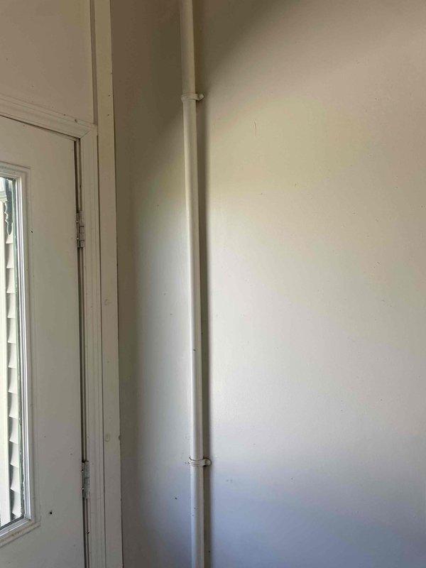Conducted on-site electrical assessment for whole-house generator installation at residential property with no existing backup power system. Evaluated electrical service panel location, identified optimal generator placement area, and documented current electrical infrastructure including main service entrance and available conduit pathways. Photographed existing conditions to support equipment specifications and installation planning for future generator system integration.