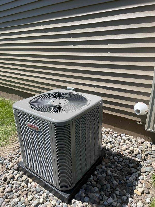 Completed full HVAC system installation including a 70,000 BTU furnace with left-side configuration, 2.5 ton Lennox air conditioning condensing unit, and humidifier. The outdoor AC unit was professionally mounted on a vibration-dampening pad over a gravel bed with proper drainage, and all refrigerant lines and electrical connections were completed. Reconnected existing components and verified system operation for both heating and cooling functionality.