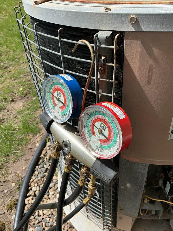 Completed annual preventative maintenance on residential air conditioning system. Performed comprehensive system inspection including electrical diagnostics with multimeter testing of contactors and connections, refrigerant pressure readings using manifold gauges to verify proper system charge, and filter replacement. All electrical components tested within normal operating parameters, refrigerant pressures confirmed at manufacturer specifications, and unit found to be operating efficiently with no deficiencies noted.