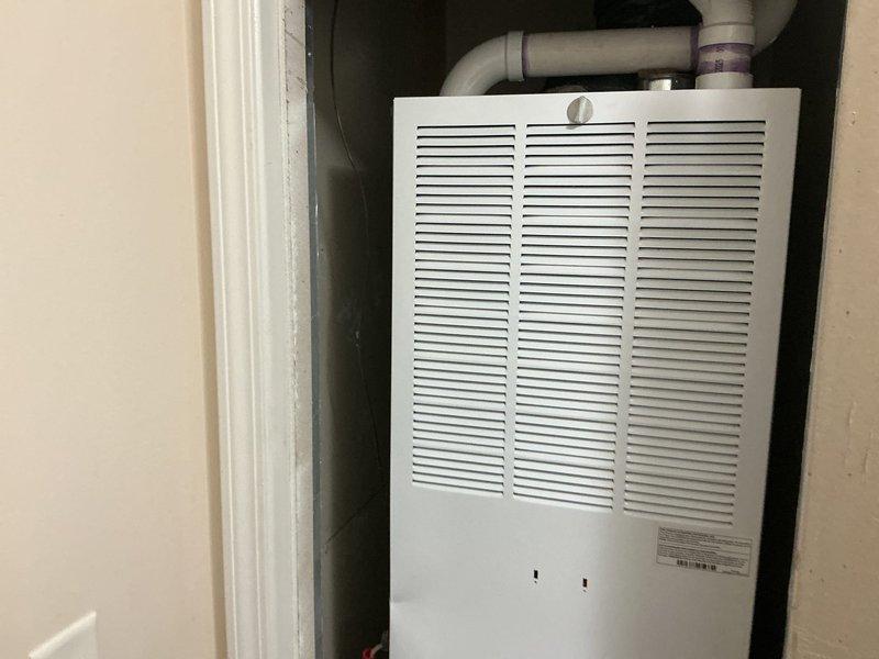 Completed full HVAC system installation in mobile home including 70,000 BTU furnace and 2.5 ton air conditioning unit with rear discharge configuration. Installed equipment in utility closet, established all necessary connections for heating and cooling operation, and reconnected existing ductwork and electrical systems. All mechanical permits secured and installation completed per code requirements with system tested and operational.