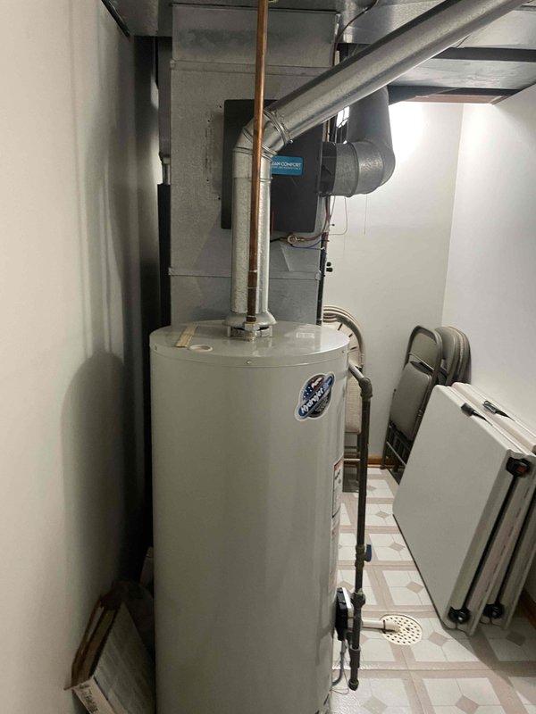Conducted on-site evaluation for Generac generator installation at a 30-year-old residential property. Assessed existing electrical infrastructure, including main service panel accessibility and available capacity for generator integration. Documented current utility room configuration, photographing water heater, HVAC equipment placement, and available wall cavity space for potential electrical conduit routing to determine optimal generator placement and transfer switch installation location.