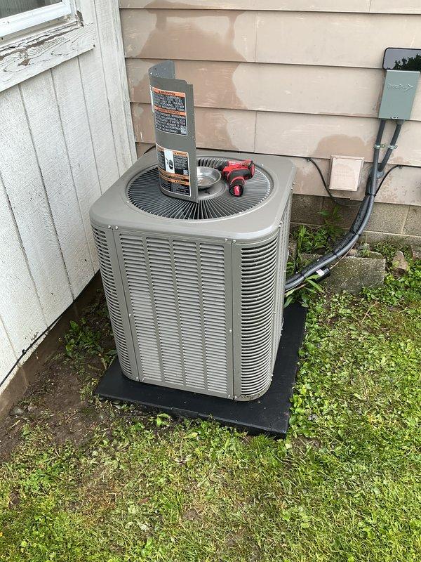 Completed routine air conditioning maintenance inspection on outdoor condensing unit. Unit found in operational condition with proper airflow through louvers and fan grille functioning normally. Refrigerant lines inspected and found secure with insulation intact. Electrical disconnect and conduit connections verified. Customer advised that air filter replacement is needed to maintain system efficiency and indoor air quality.