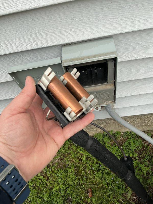 Completed annual cooling maintenance on residential HVAC system. Inspected and photographed electrical disconnect with fuses, verified proper operation and secure connections. Checked refrigerant service valves on outdoor condensing unit, confirmed valve integrity and proper sealing. Performed standard ACM protocol including visual inspection of condenser unit, verified fan operation, and assessed overall system condition. All components functioning within normal parameters, no immediate repairs required.
